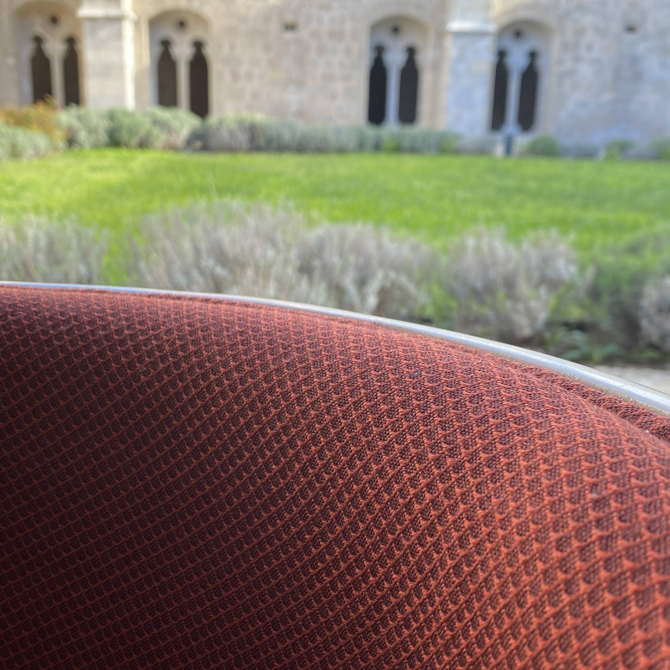 Two cognac-colored swivel chairs made of fiberglass from the 1970s