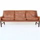 Canapé scandinave trois places en palissandre et cuir marron Danemark 1960