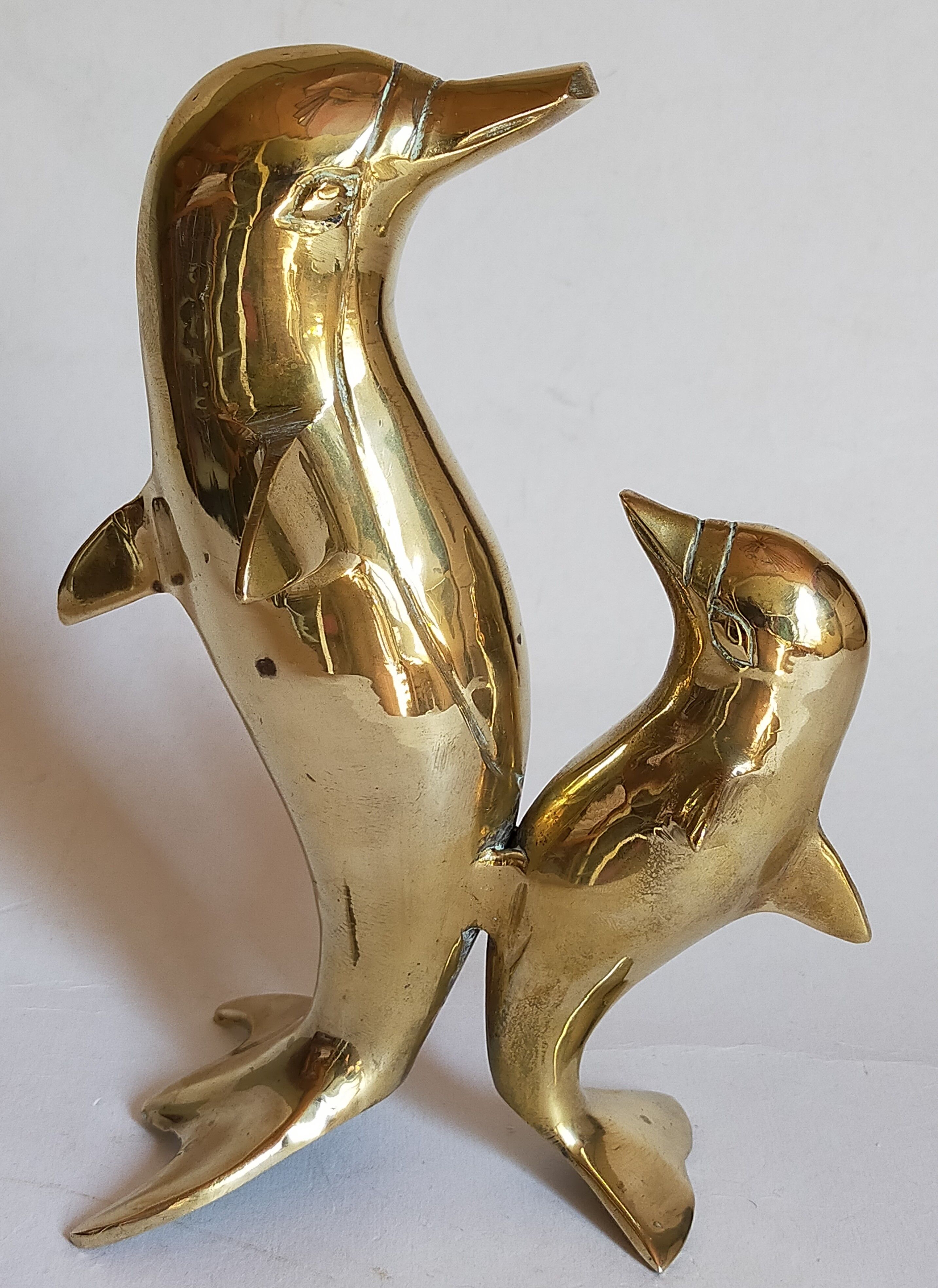 Vintage solid brass dolphins