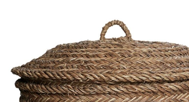 Hand-woven laundry basket in natural rush