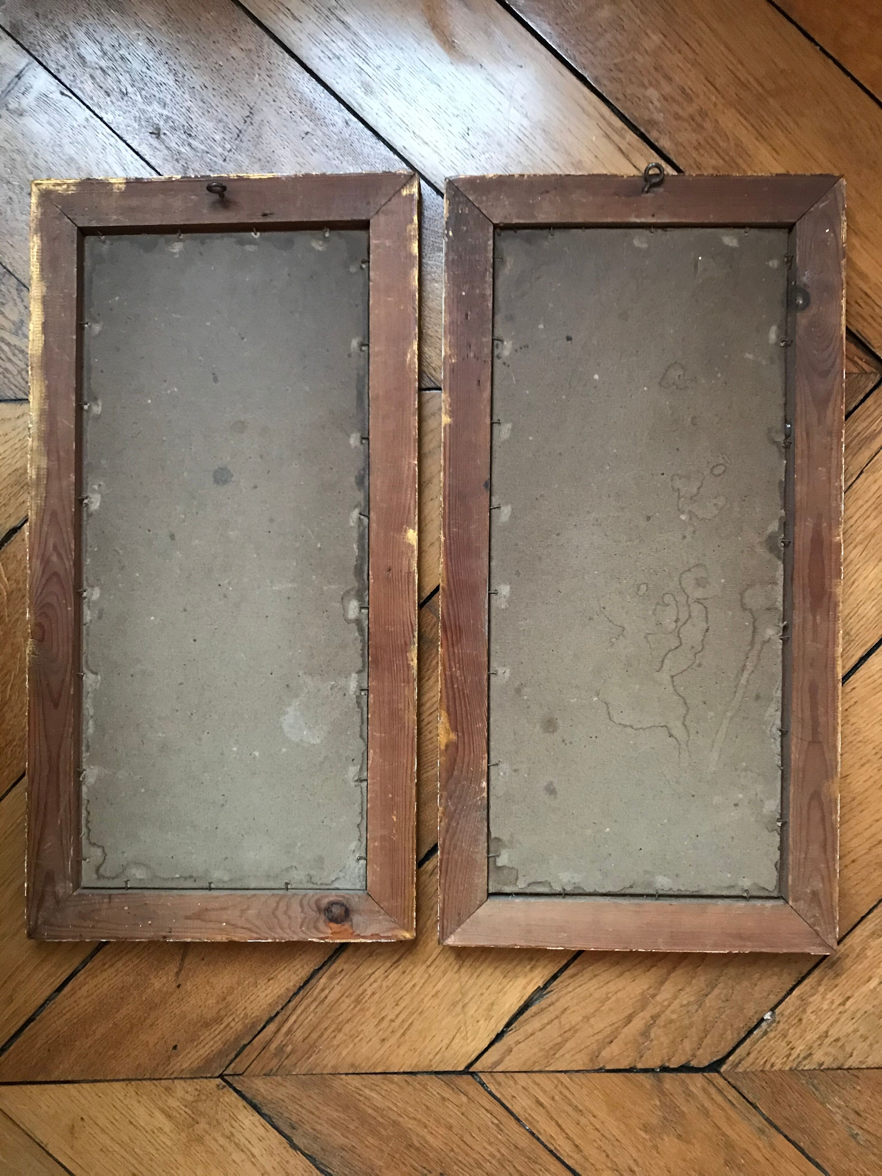 Two old paintings of flowers and gilded frames