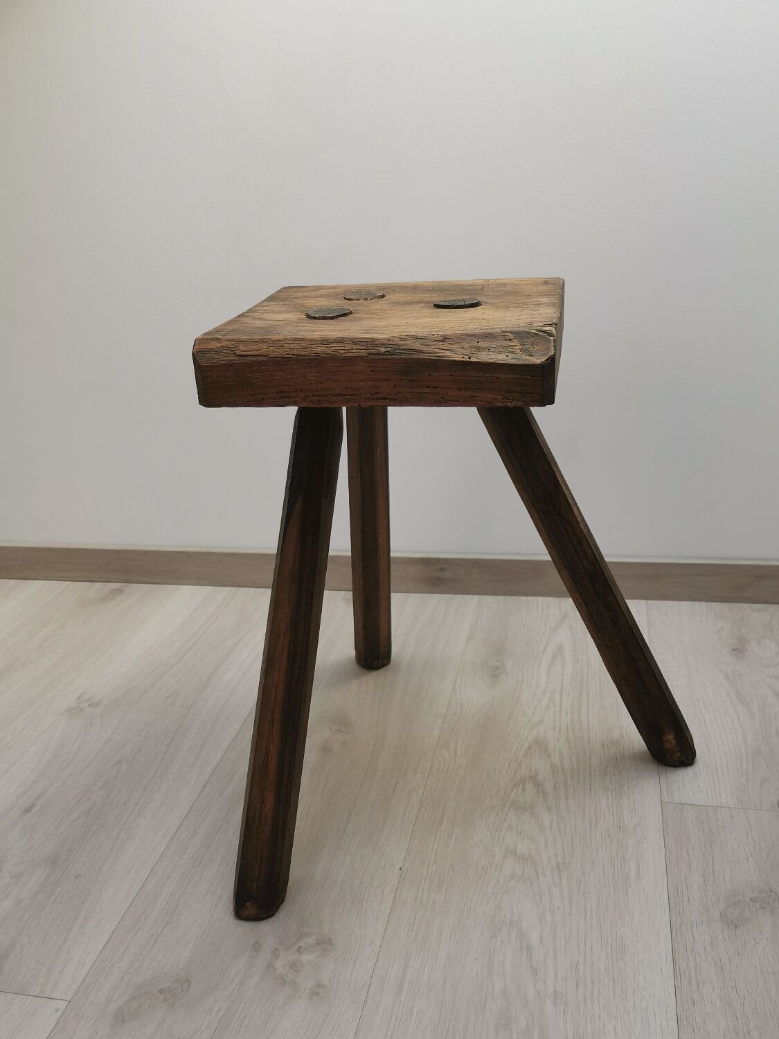 Old wooden stool tripods