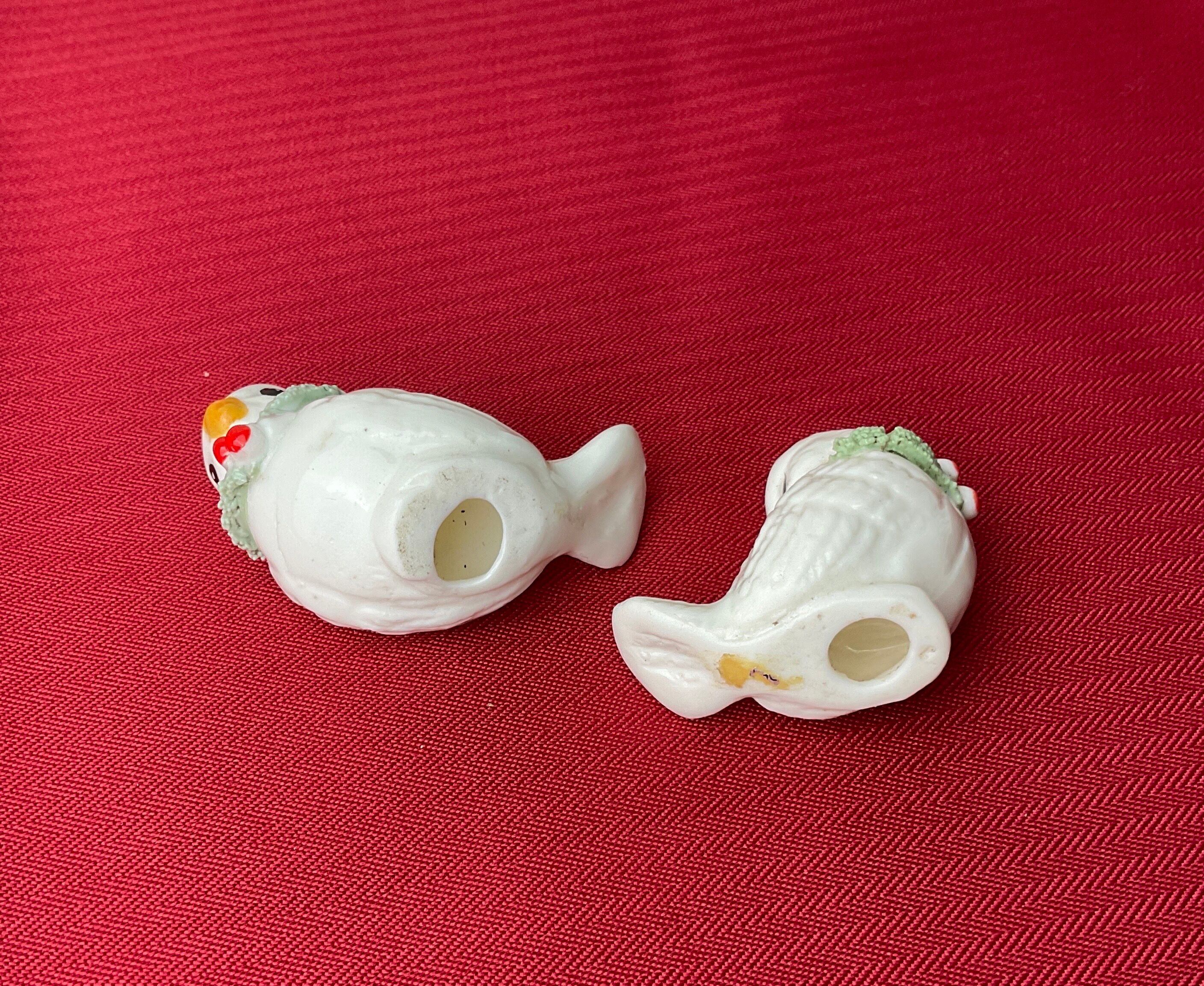Pair of miniature white birds in ancient ceramics