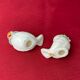 Pair of miniature white birds in ancient ceramics
