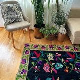 Romanian wool carpet floral design with green border on black background 180x153cm