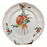 Easternth century earthenware plate, ribboned floral decoration