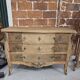 Stripped chest of drawers with bronze handles