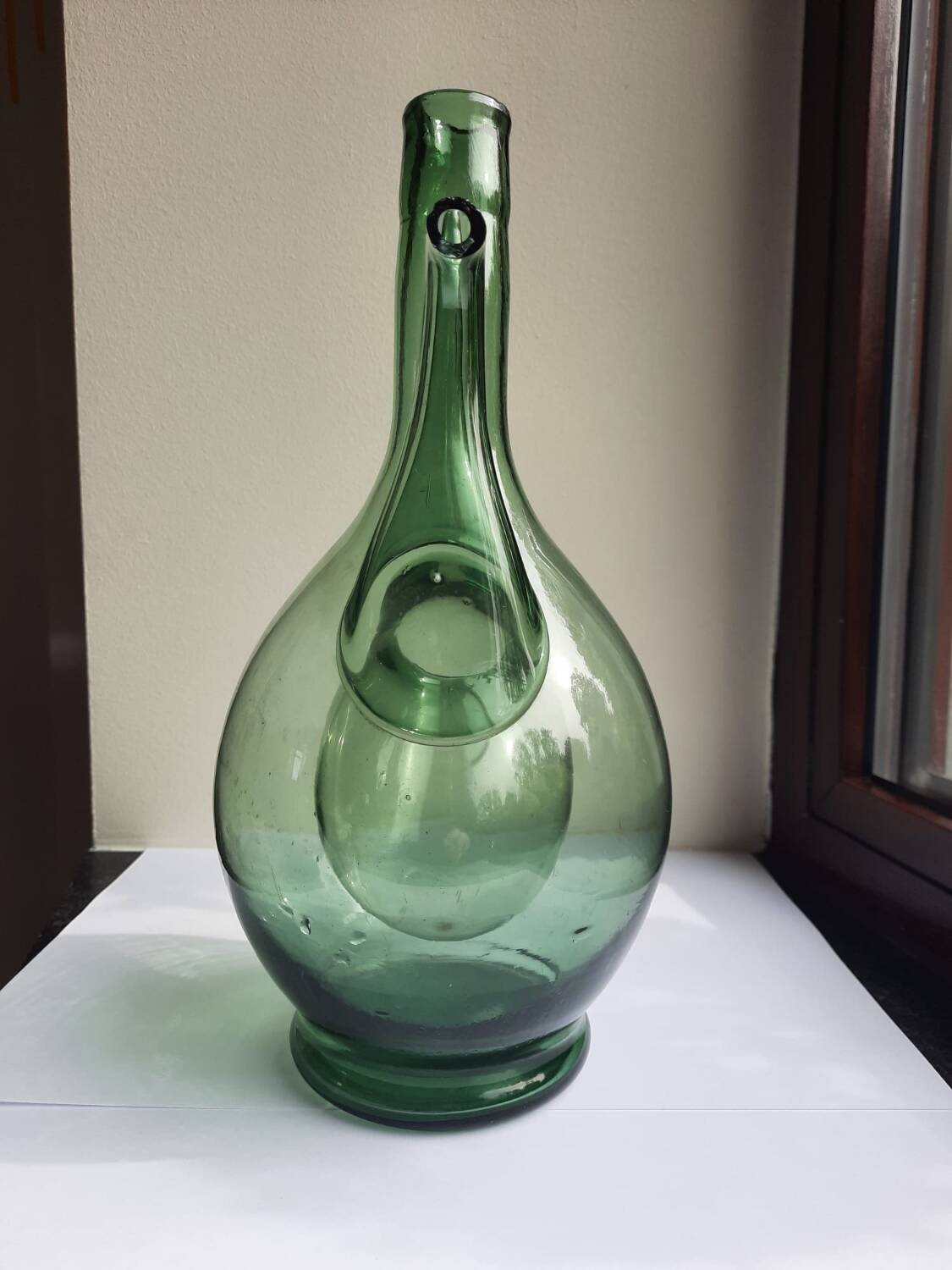 Pair of blown glass wine decanters in blue/green hues.