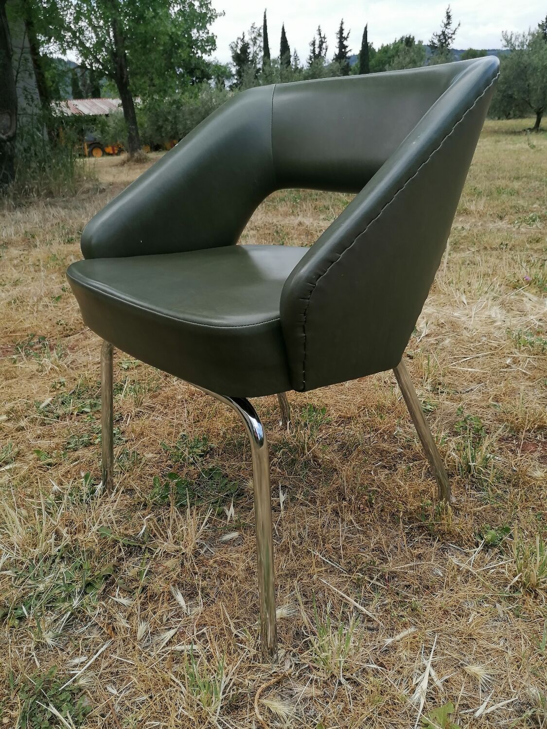 Vintage conference armchair in green skai Roset SNA