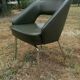 Vintage conference armchair in green skai Roset SNA