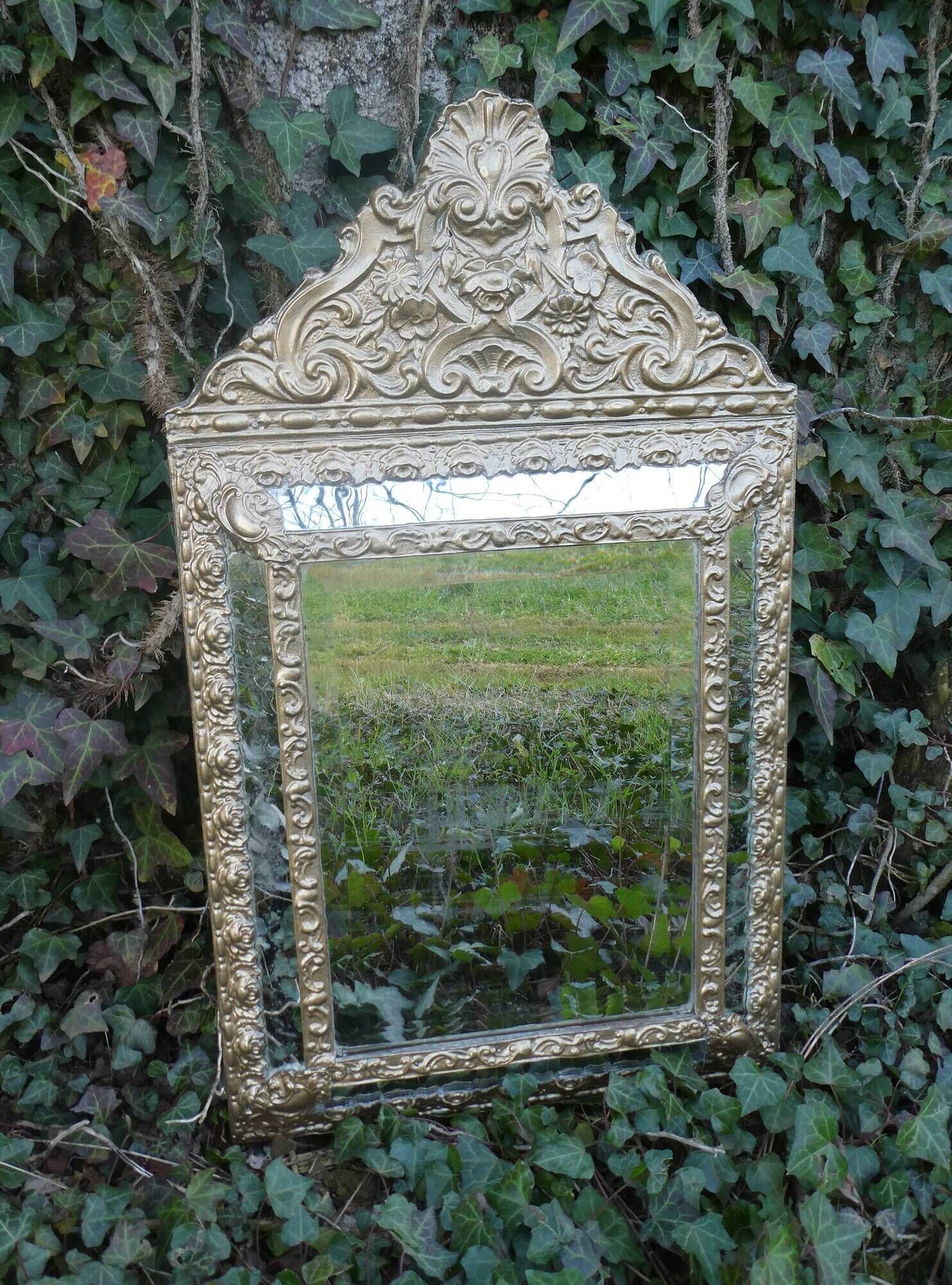 Old mirror with closed screens in golden repelled brass 72 x 42 cm