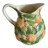 Orange slipware pitcher