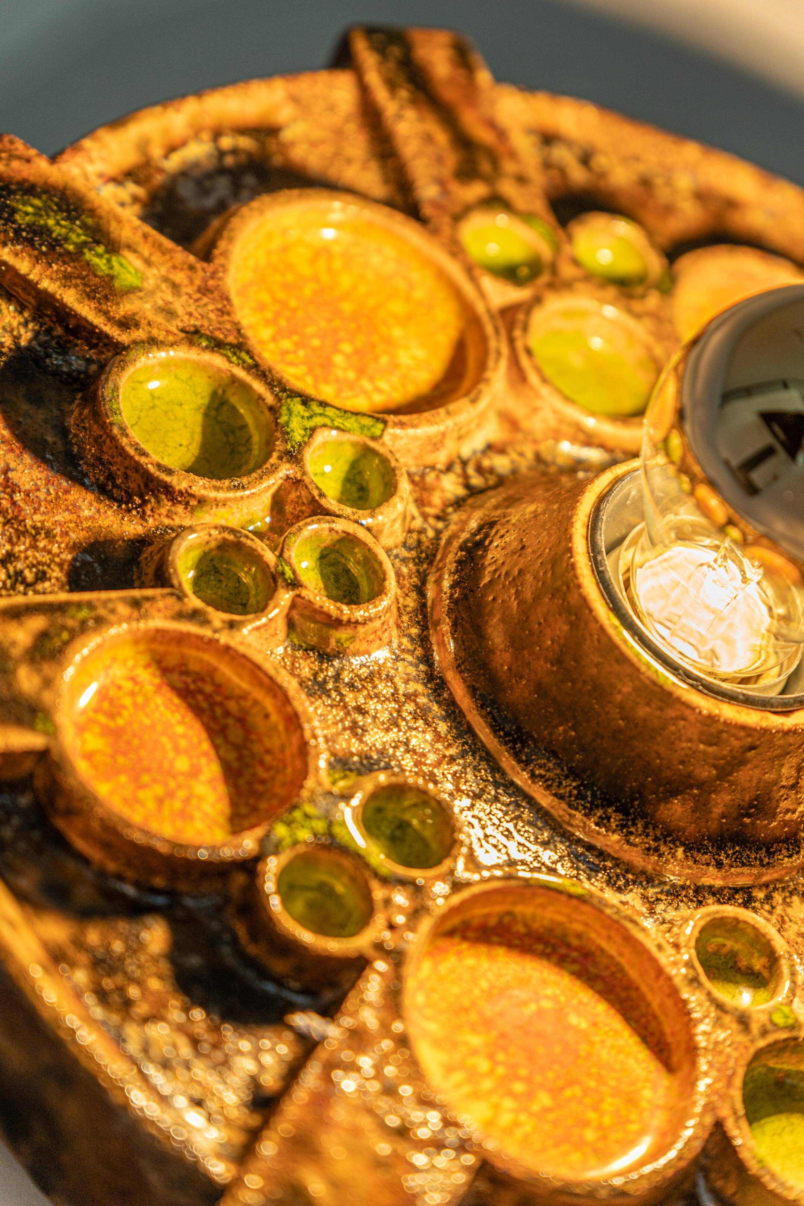 Sputnik wall lamp in brown and orange ceramic, Germany, 1970s.