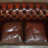 Pair of restored antique Chesterfield sofas in Boudreaux leather.