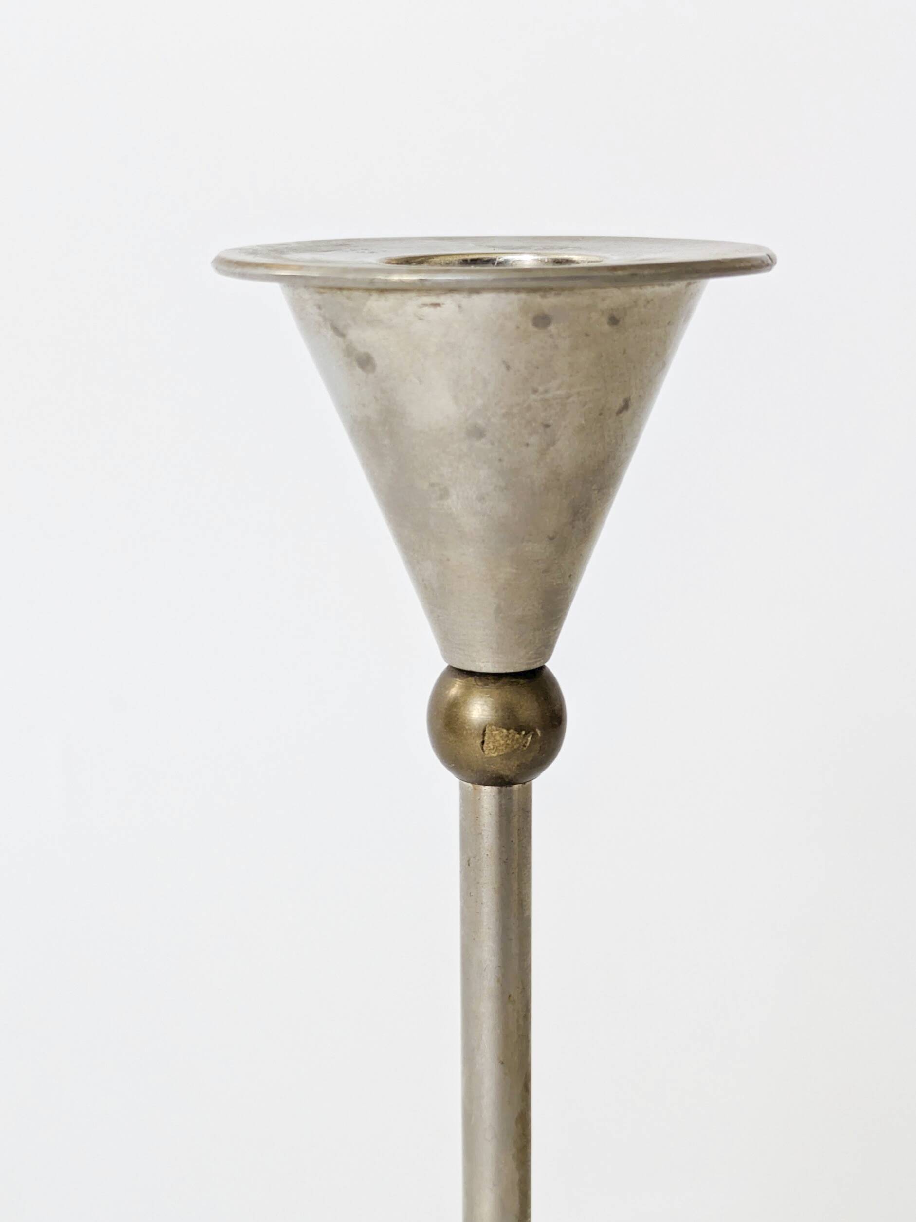 Pair of postmodern candlesticks in Memphis style made of steel and brass.