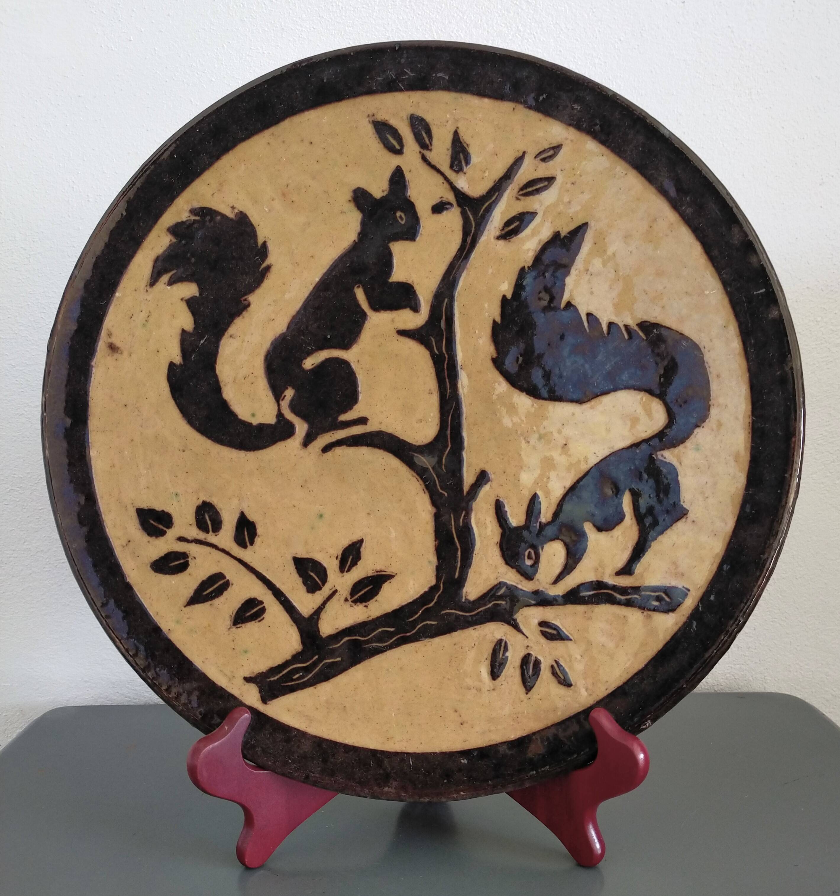 Vintage plate from Dauphiné in glazed terracotta with squirrels.