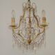 French gilt bronze three-light cage chandelier with pink and clear beaded swags.