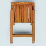 Old varnished wooden folding chair for children