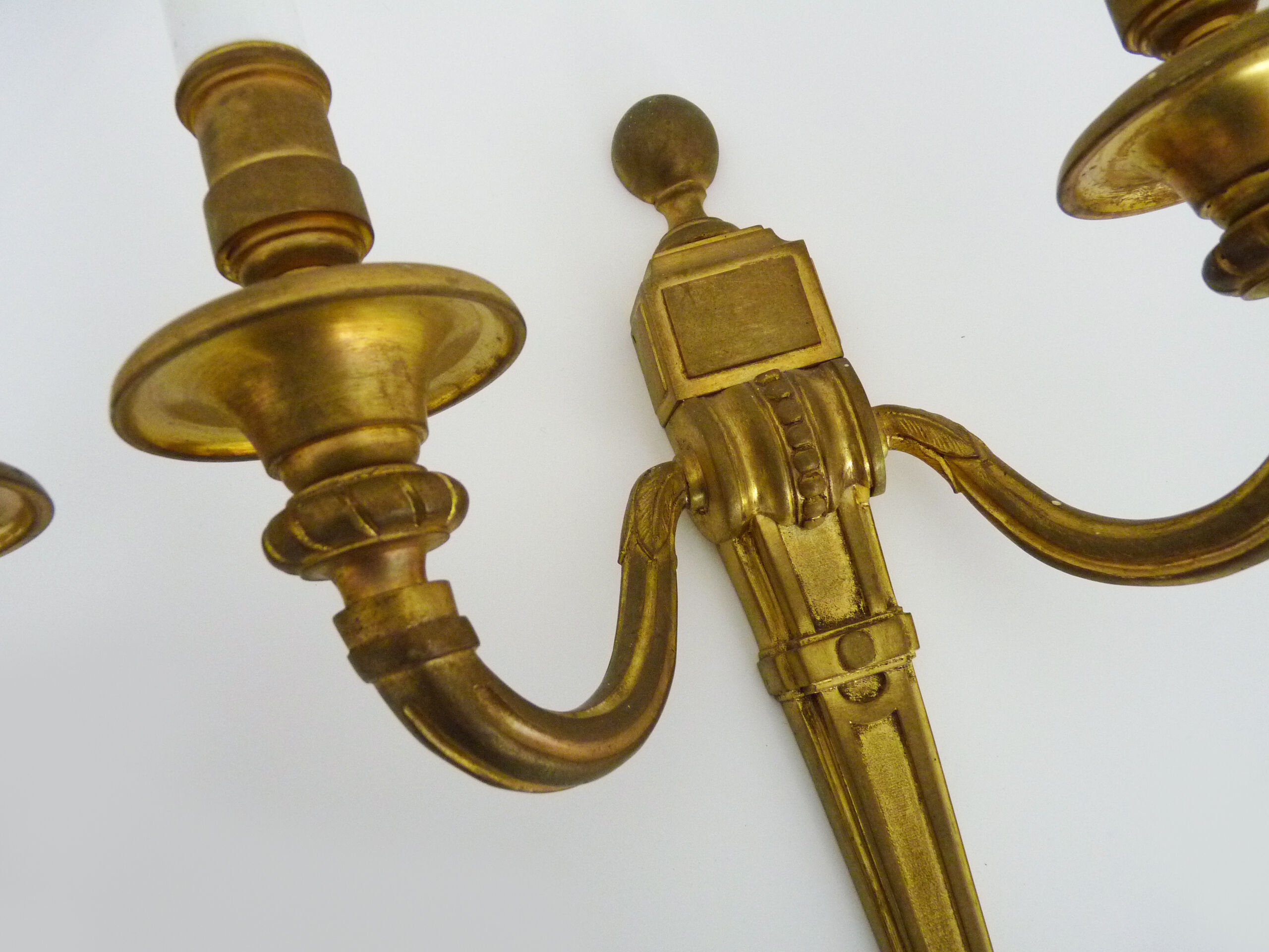 Old pair of bronze double fire wall sconces, signed md