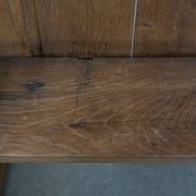 Antique oak church bench in Gothic style with beautiful wood carving
