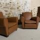 Pair of vintage club style armchairs in camel faux leather.
