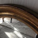 Antique oval gilded stucco mirror