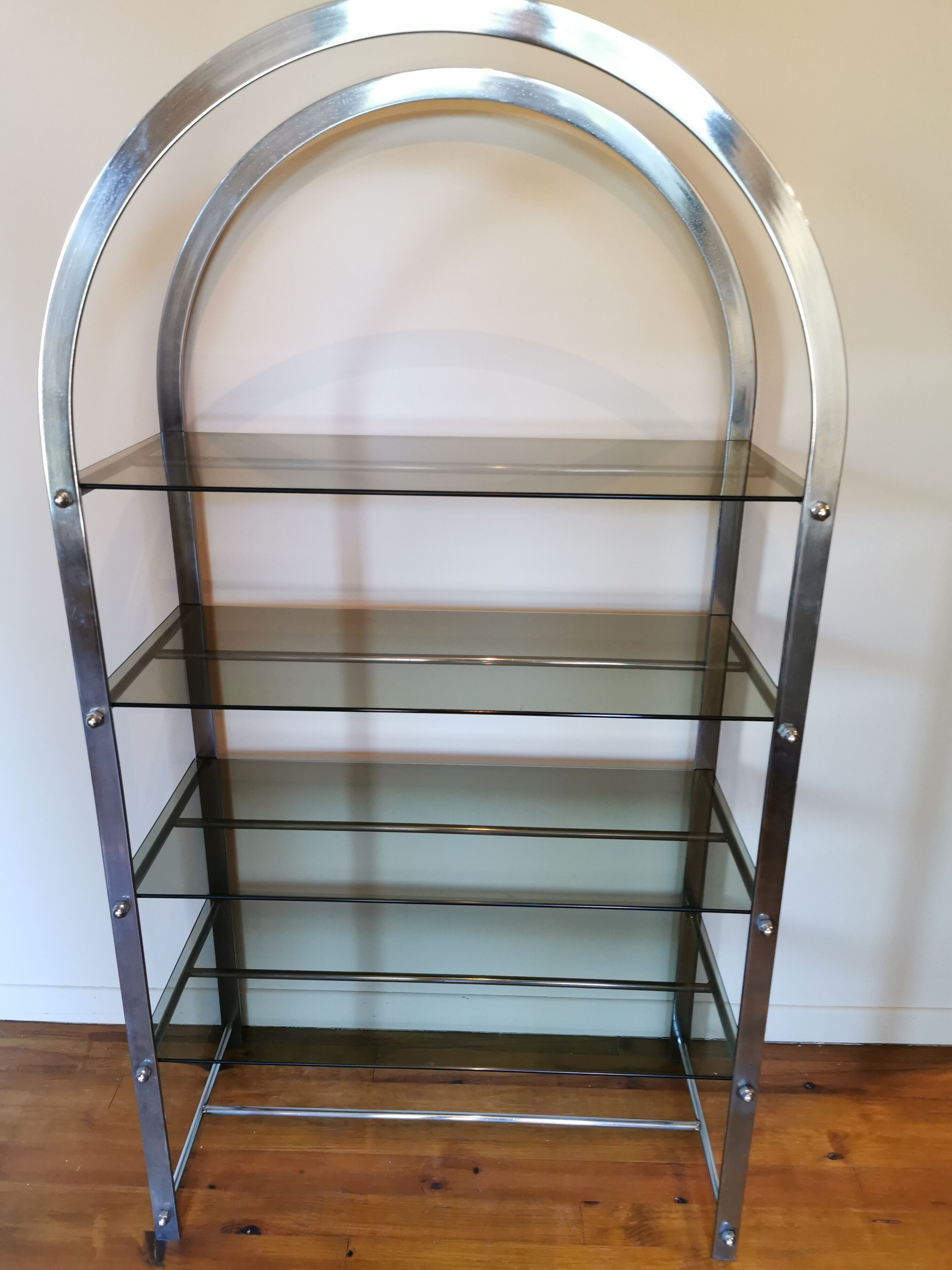 Rounded shelf from the 70s in chrome metal and glass