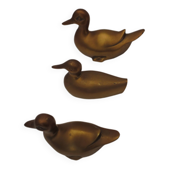 Trio of ducks in solid gilded brass