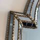Mirror consisting of multi-faceted mirrors and brass garlands, French work, around 1970