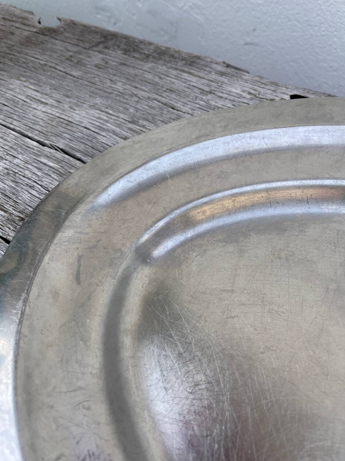 Oval stainless steel dish, signed Rémi Letang