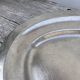 Oval stainless steel dish, signed Rémi Letang