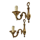 2 gold-plated brass wall lights in Louis XVI style with acanthus and pine cones, circa 1960.