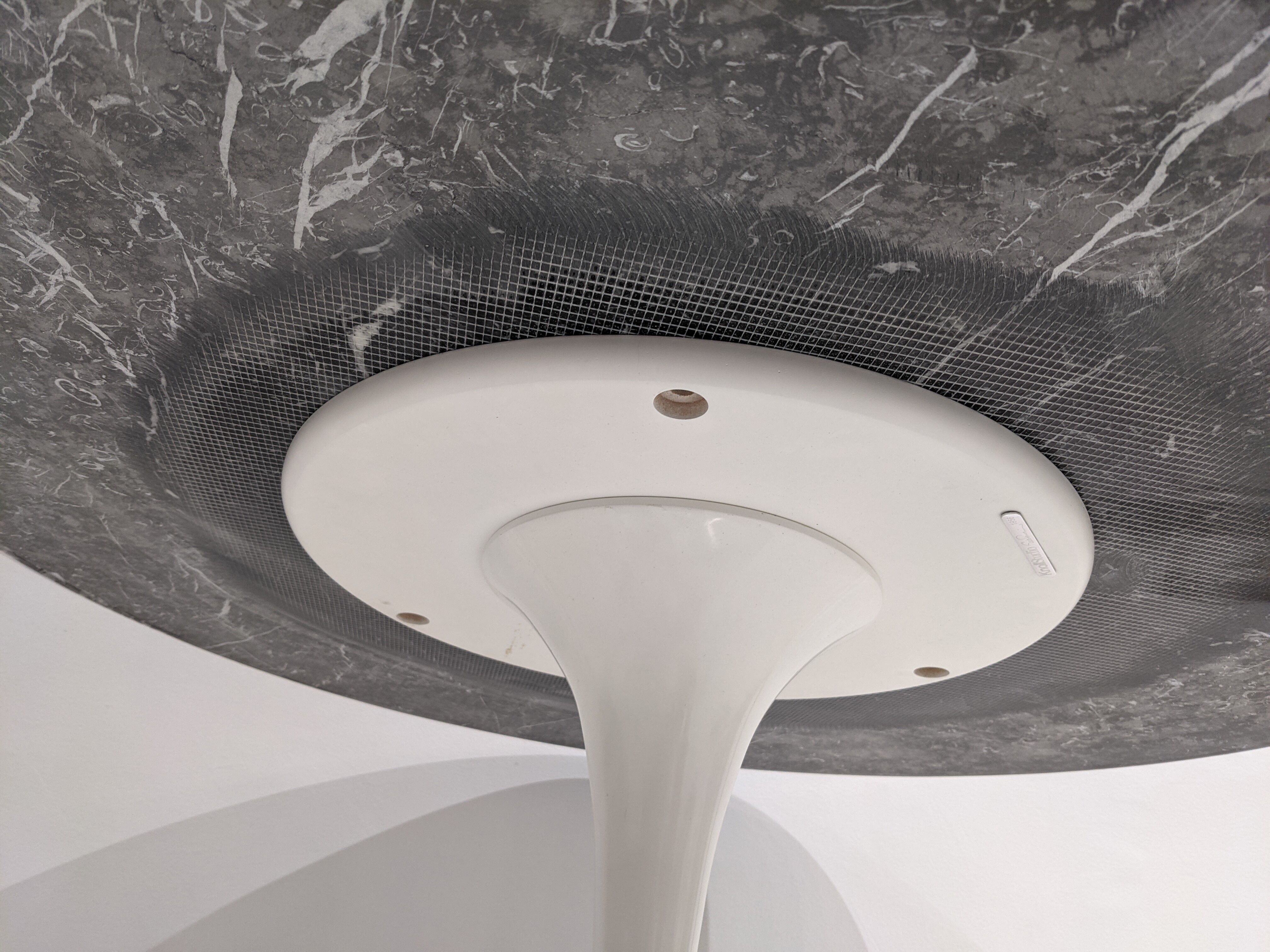 Tulip table white base and black marble marked by Saarinen edition knoll international