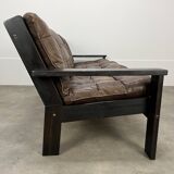 Living room sofa and brutalist armchairs in leather and wood, 70s, chalet style