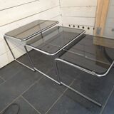 Nesting tables in chromed metal with smoked glass tops from the 1970s