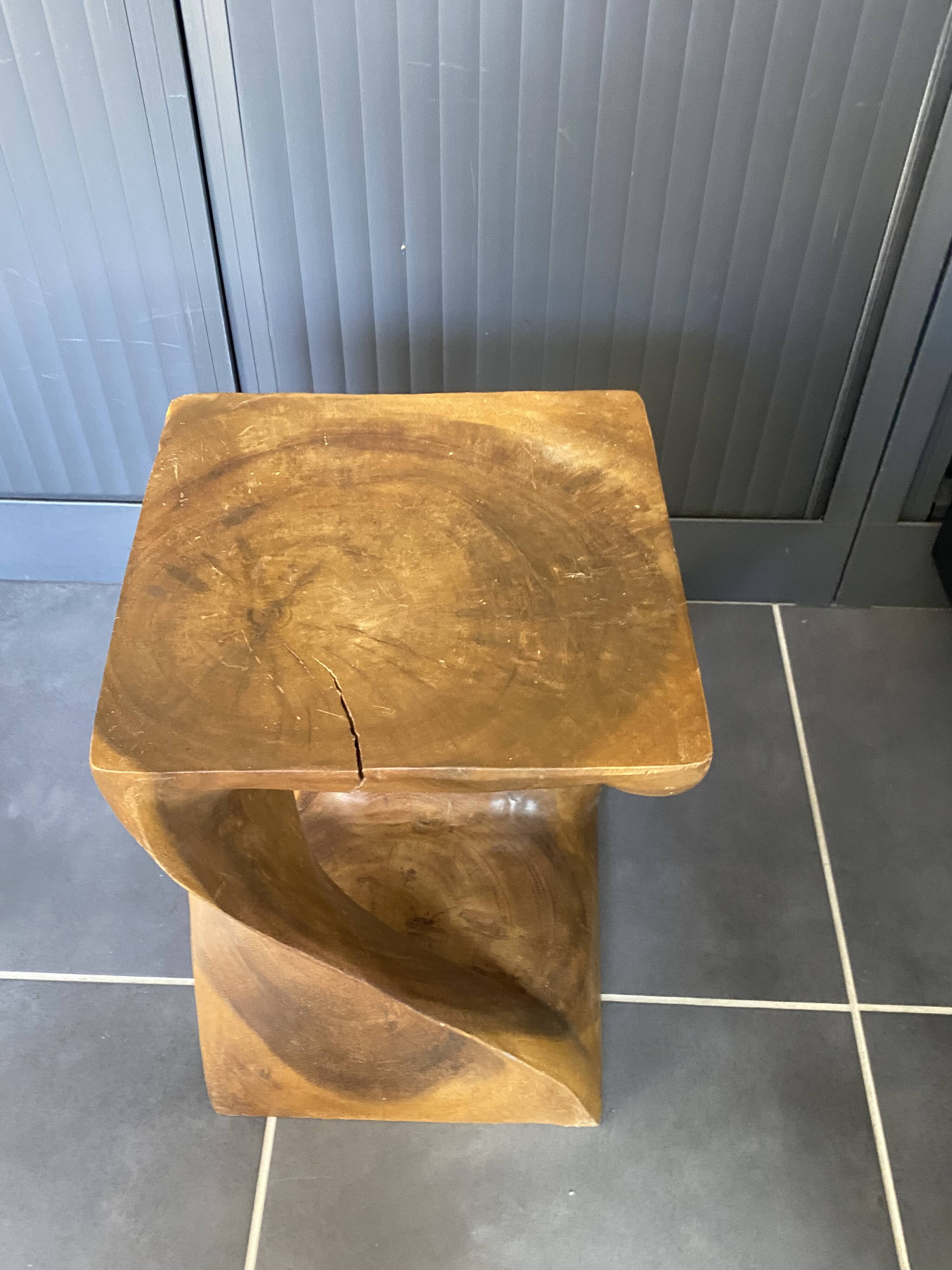 Stool no. 1 in solid raw walnut wood, carved from the mass, 1970.