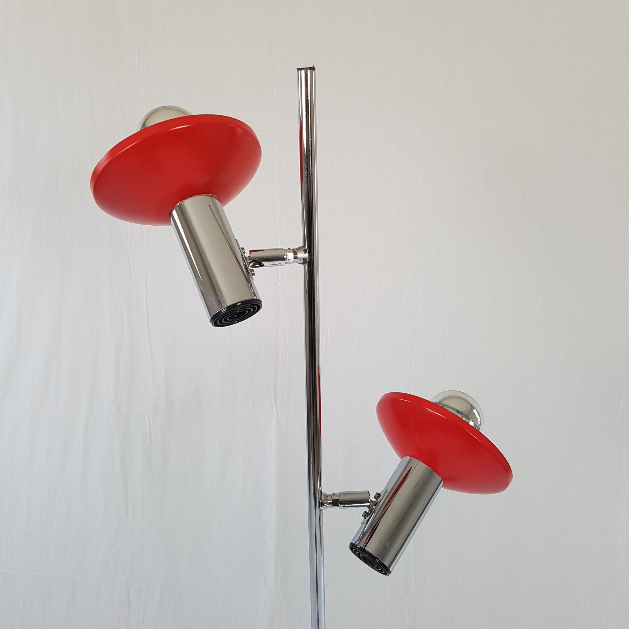 Two red lights and chrome floor lamp