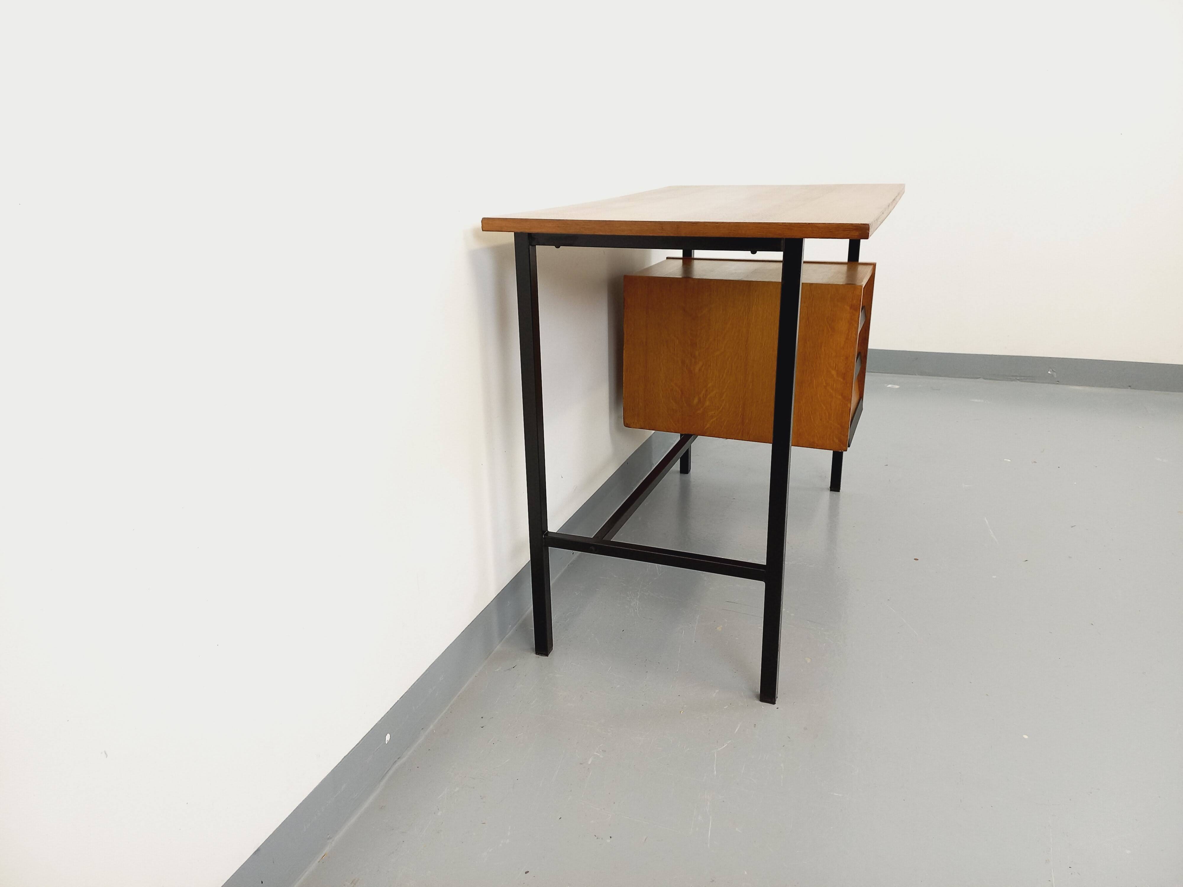 Vintage modernist desk in wood and black metal from the 60s