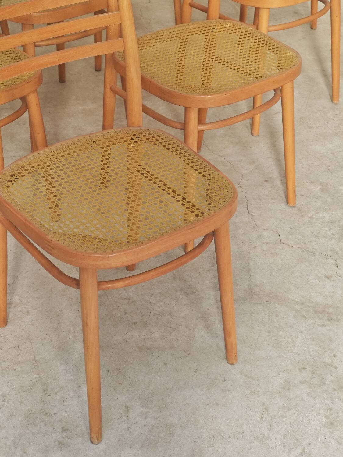 Set of 10 Bystrice tone wooden and caned chairs from the 1960s.