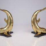 Solid brass dolphin console feet.