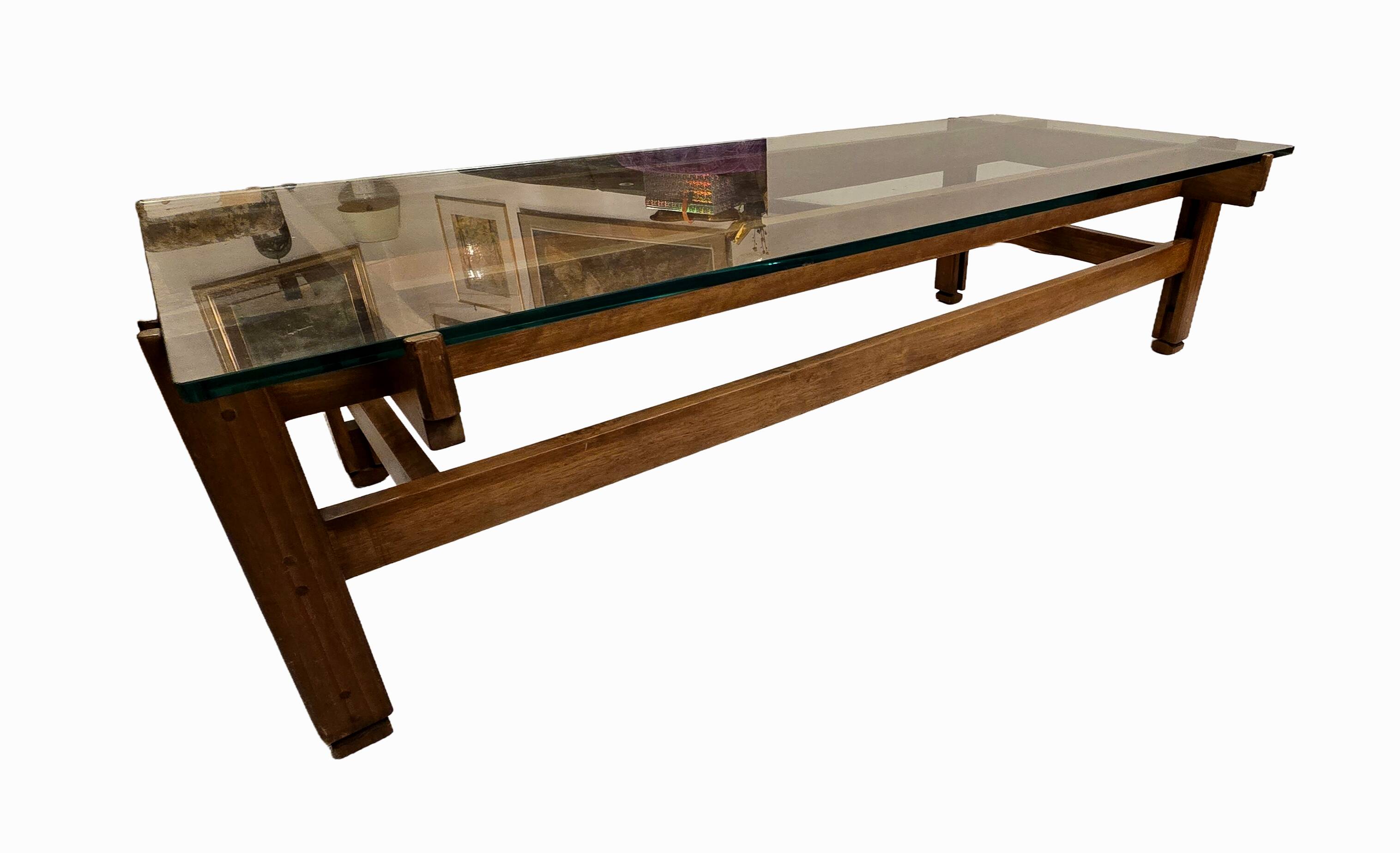 Glass coffee table with a wooden frame.