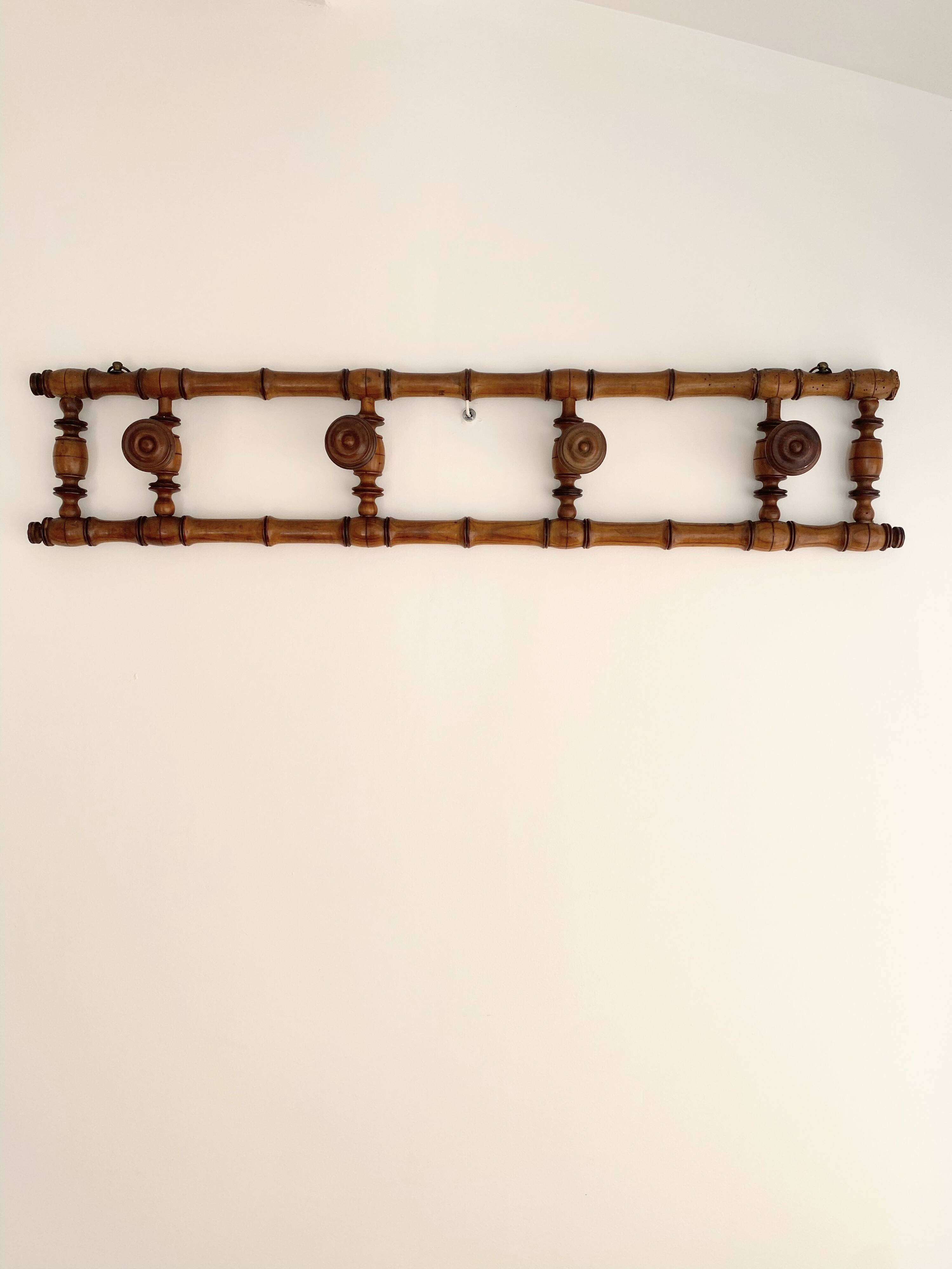 Vintage wooden wall coat rack with 4 swivel hooks from 1920
