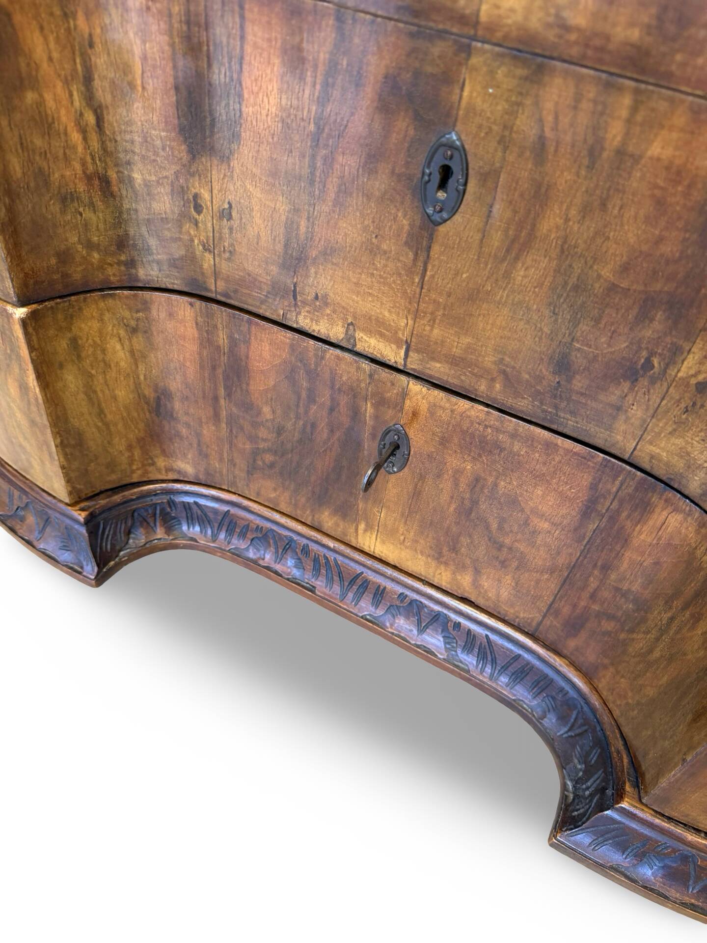 serpentine commode in antique walnut