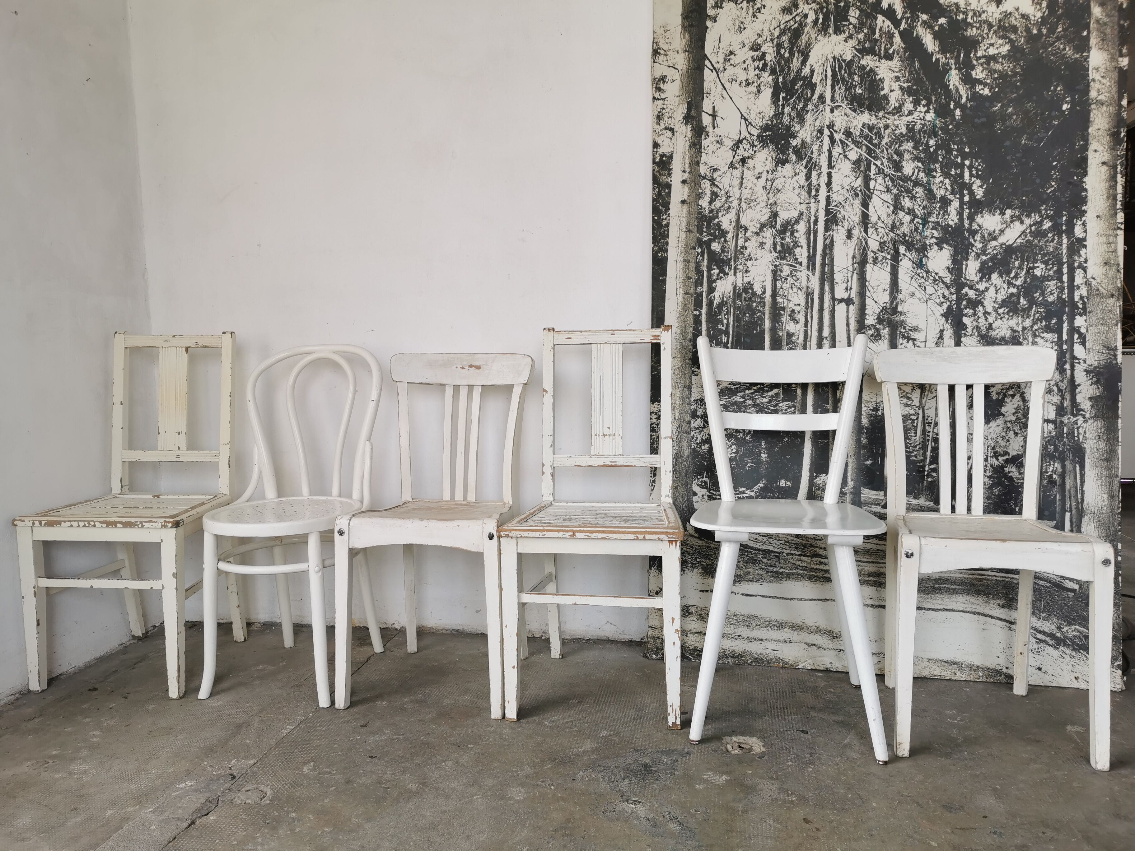 Set of 6 mismatched white chairs