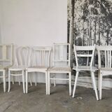 Set of 6 mismatched white chairs