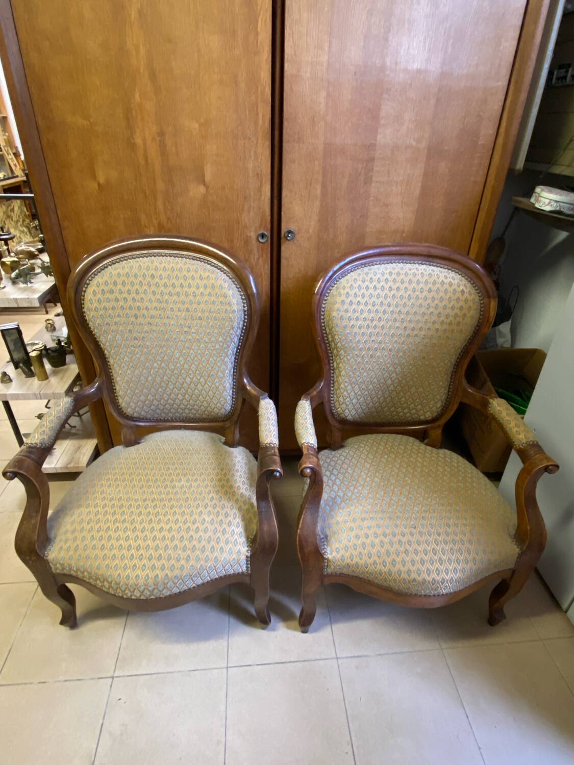 Two Louis XV style wooden and fabric armchairs