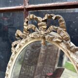 Small old oval gilded mirror