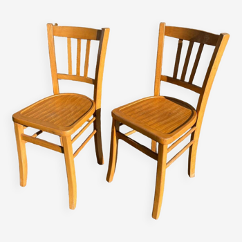 Pair of honey-colored luterma bistro chairs