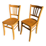 Pair of honey-colored luterma bistro chairs