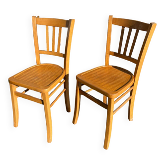 Pair of honey-colored luterma bistro chairs